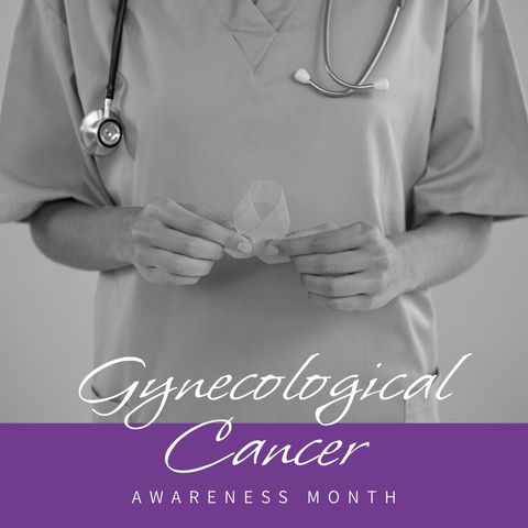 Female doctor holding ribbon for gynecological cancer awareness