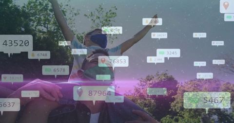 Father carrying son on shoulders wearing cloth masks in park with digital location and data overlays