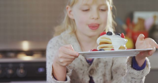 Young Girl Ready to Enjoy Stack of Fluffy Pancakes with Berries and Cream - Download Free Stock Images Pikwizard.com