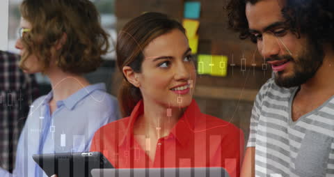 Team Collaborating with Digital Investment Tools and Financial Data Visuals