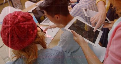 Modern Team Collaboration with Tablets and Laptops in Tech Environment