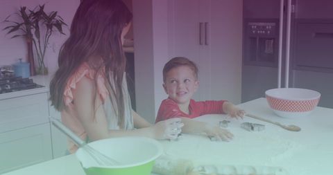 Siblings Joyfully Baking in Kitchen for Siblings Day Awareness