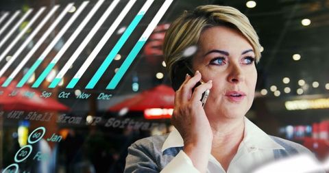 Businesswoman engaged in phone communication with digital interface overlay