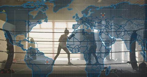 Backlit boxing sparring in industrial gym with world map overlay for global fitness campaign
