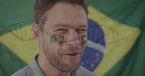 Cheering Enthusiastic Man Celebrates with Brazilian Flag Backdrop