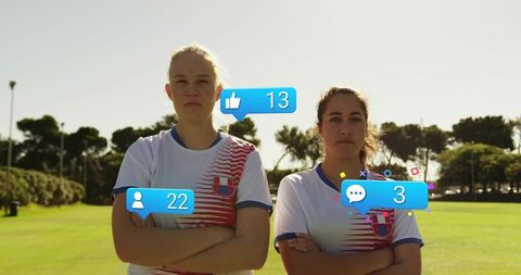Female soccer players standing confidently on sunlit field with social media icons overlay