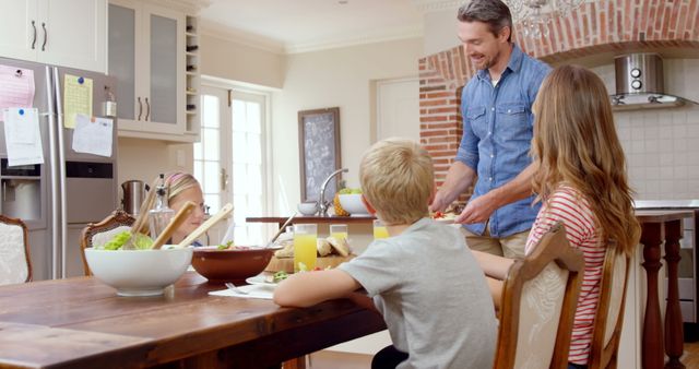 Smiling Family Enjoying Breakfast in Bright Modern Kitchen - Download Free Stock Images Pikwizard.com