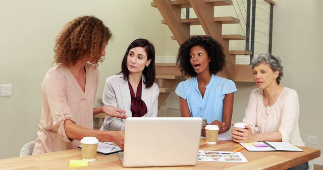 Diverse Women Collaborating on Work Project at Office Table - Download Free Stock Images Pikwizard.com