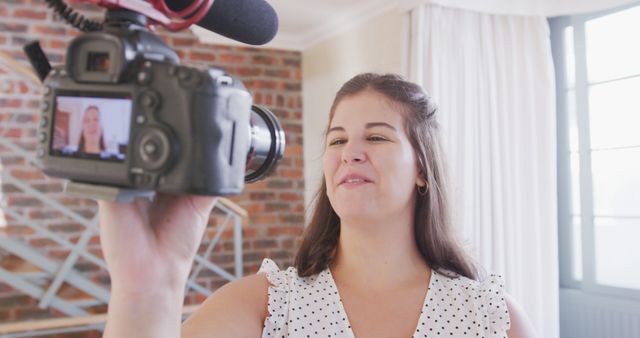 Female Vlogger Recording Video Indoors with a Professional Camera - Download Free Stock Images Pikwizard.com