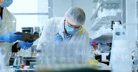 Pipetting Scientist Wearing PPE Conducting Precision Micropipette Dispensing in Laboratory