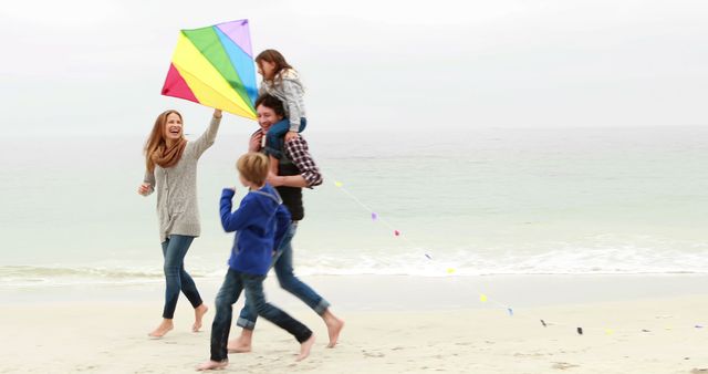 Family Flying Colorful Kite on Beach - Download Free Stock Images Pikwizard.com