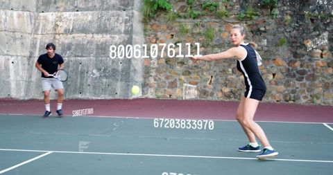 Focused Tennis Duo with Dynamic Numbers Overlay on Court