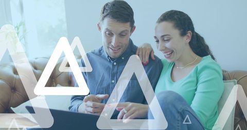 Couple Using Laptop with Digital Technology Graphics