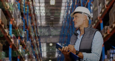 Warehouse Worker Analyzing Inventory with Digital Interface Display - Download Free Stock Images Pikwizard.com