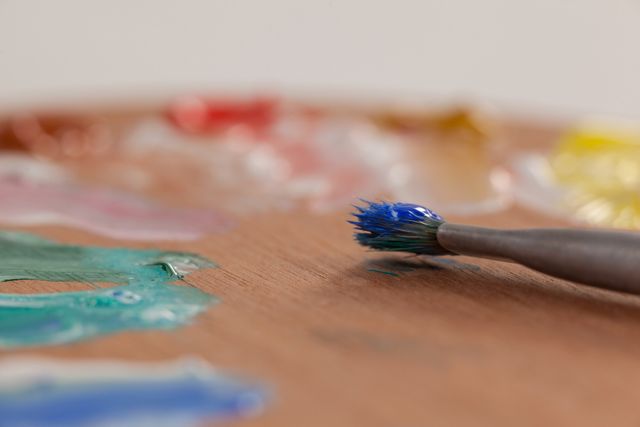 Paint brush and palette against white background - Download Free Stock Photos Pikwizard.com