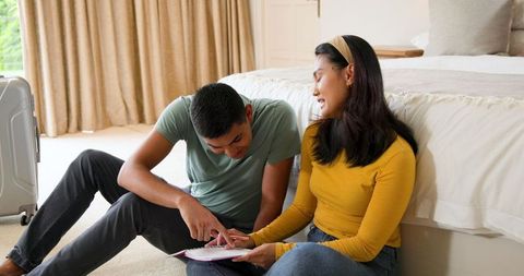 Young couple planning beach vacation