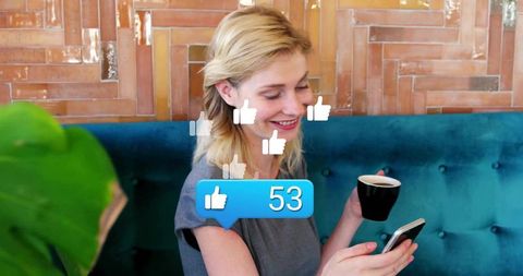 Smiling Woman Enjoying Social Media in Hip Cafe with Coffee