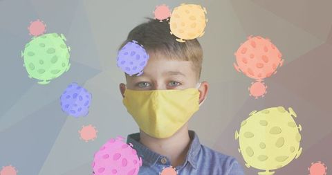 Boy wearing yellow mask with abstract virus illustrations
