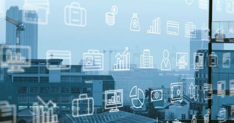 Displaying business data icons over urban skyline through office window