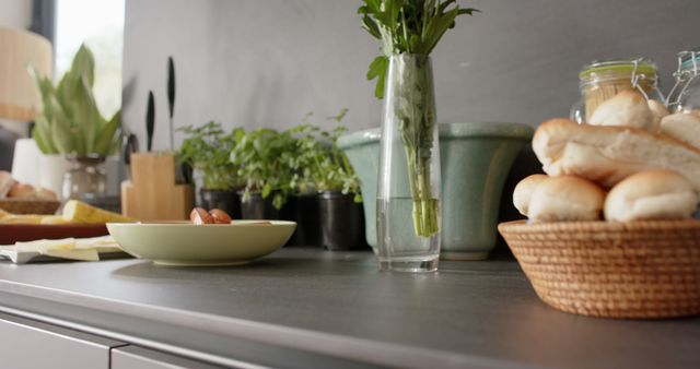 Modern Kitchen Countertop with Fresh Herbs and Bread Basket - Download Free Stock Photos Pikwizard.com