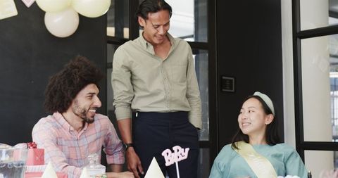 Diverse Team Celebrating Baby Shower at Office Gathering