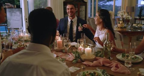 Happy Couple Celebrating Elegant Wedding Reception with Friends