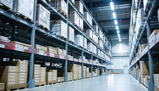 Spacious warehouse aisle showing high pallet racking and organized inventory