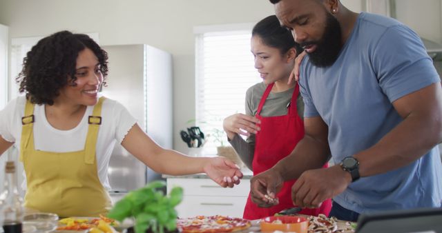 Diverse Friends Enjoy Casual Pizza Cooking - Download Free Stock Images Pikwizard.com