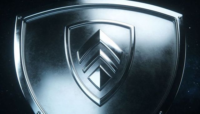 Displaying brushed chrome shield with chevron crest and diamond insignia, riveted rim