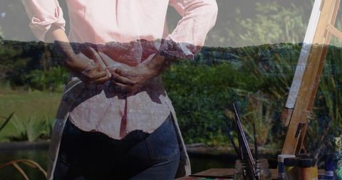 Artist preparing to paint at tranquil outdoor setup