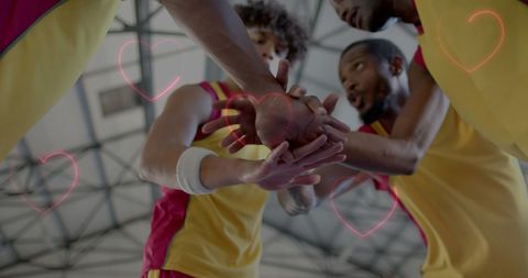 Unity and Team Spirit Among Basketball Players with Overlay Hearts