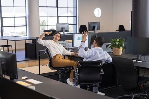 Diverse Teamwork and Collaboration in Modern Office Environment