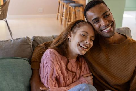 Couple Sharing Cozy Moment Together on Comfortable Sofa