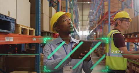Warehouse lead scanning pallets with tablet using AR inventory analytics