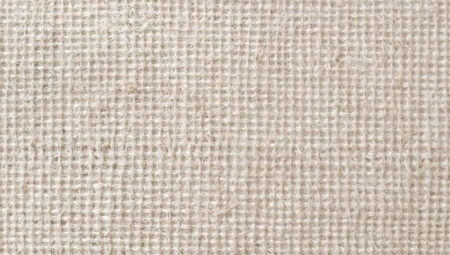 Beige burlap cloth closeup showing coarse jute weave texture natural neutral background