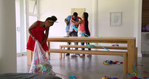 Family Cleans Up After Party Together with Bonding Moment