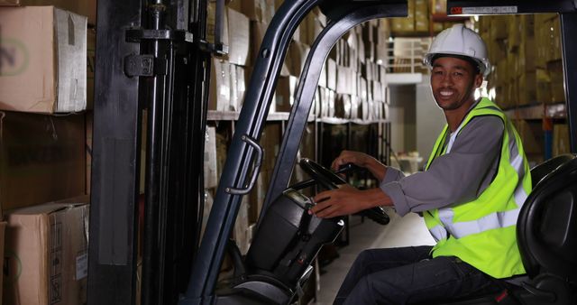 Smiling Warehouse Worker Operating Forklift in Storage Facility - Download Free Stock Images Pikwizard.com