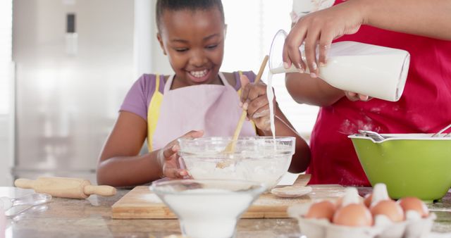 Happy Mother and Daughter Baking Together in Modern Kitchen - Download Free Stock Images Pikwizard.com