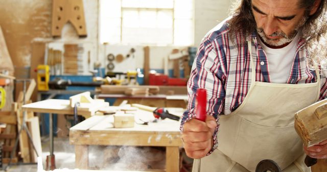 Craftsman Focusing on Woodworking in Workshop - Download Free Stock Images Pikwizard.com