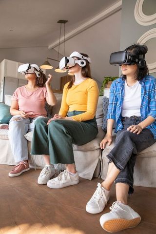Diverse Women Engaging with VR Technology in Cozy Living Room