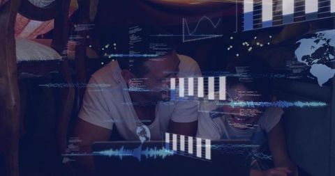Father and son studying together on laptop with data visualization and analytics overlay