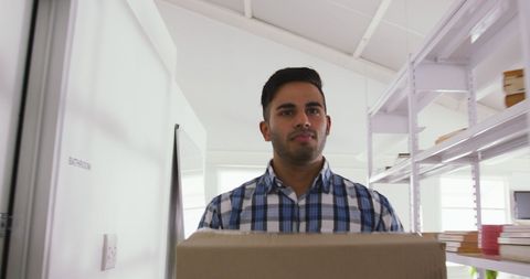 Young Professional Moving into Modern Office - Download Free Stock Images Pikwizard.com