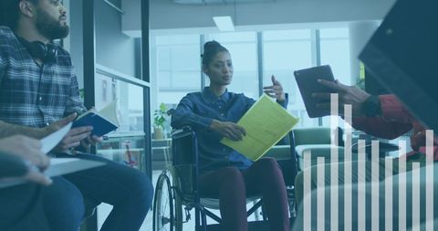 Casual Business Meeting with Diverse Team and Data Analytics