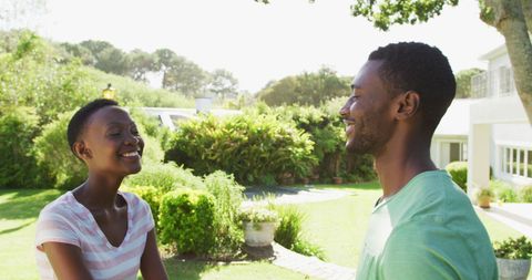 Happy Couple Hugging in Sunny Garden