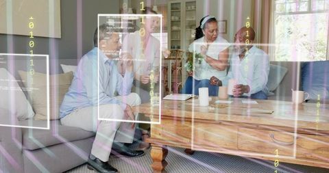 Multigenerational adults chatting around living room table with augmented data overlay
