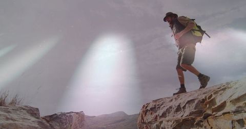 Hiker Venturing Across Rocky Canyon in Scenic Wilderness