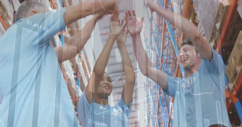 Team Celebrating Success in Warehouse with Digital Data Overlay