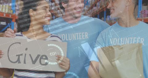Diverse Volunteers Smiling with Donations in Warehouse Setting - Download Free Stock Images Pikwizard.com