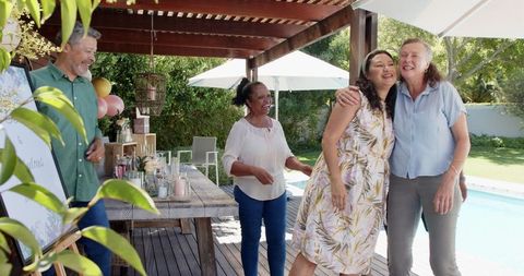 Senior Friends Celebrating Outdoors at Casual Gathering