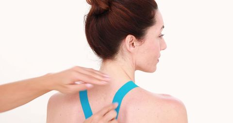 Woman relaxing with therapeutic shoulder massage for wellness